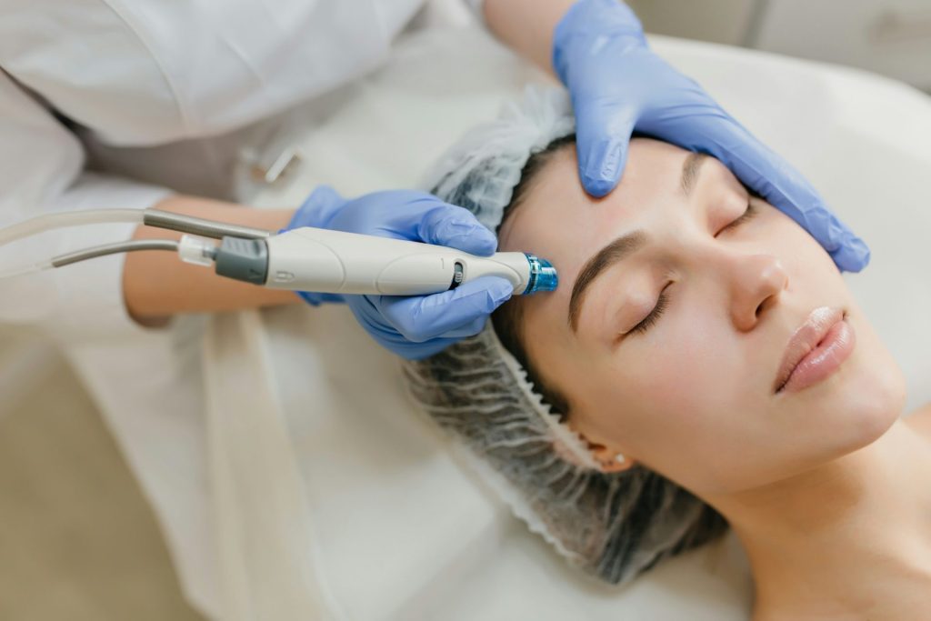 a woman getting a Laser Hair Removal of forehead